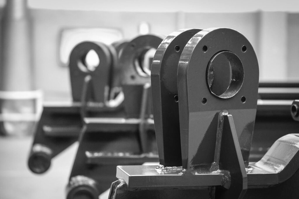 A black and white photo of a group of metal parts.