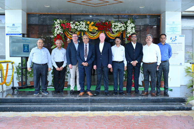 A group of men standing in front of a building.